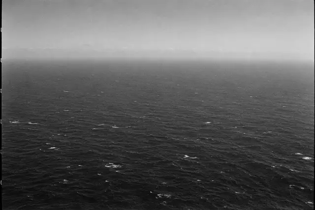 Illustration: the open Pacific Ocean seen from high altitude. AI-generated scene of the location, not evidence.